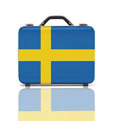 Image showing Business suitcase for travel with reflection and flag of Sweden