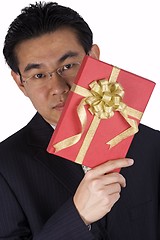 Image showing Chinese Businessman holding Present