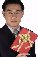 Image showing Chinese Businessman holding Present