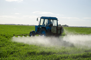 Image showing Tractor fertilize field pesticide and insecticide 