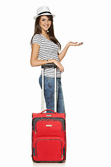 Image showing Woman tourist with suitcase