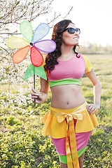 Image showing Woman with toy turbine summer vacation