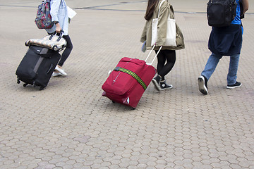 Image showing Tourists with a suitcase