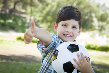 Image showing Cute Young Boy Playing with Soccer Ball in Park