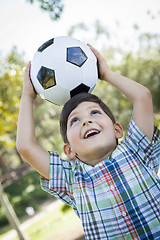 Image showing Cute Young Boy Playing with Soccer Ball in Park