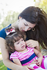 Image showing Loving Mother Consoles Crying Baby Daughter