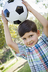 Image showing Cute Young Boy Playing with Soccer Ball in Park