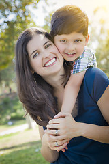 Image showing Attractive Mixed Race Mother and Son Hug in Park