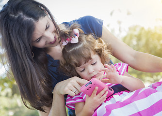 Image showing Mother and Cute Baby Daughter Playing with Cell Phone