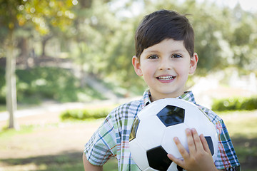 Image showing Cute Young Boy Playing with Soccer Ball in Park