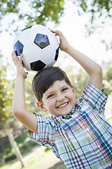 Image showing Cute Young Boy Playing with Soccer Ball in Park