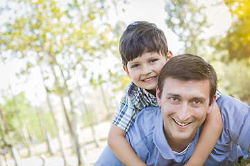 Image showing Father and Son Playing Together in the Park