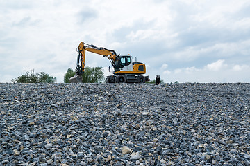 Image showing Excavator and plane