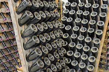 Image showing Vintage sparkling wine on rack stand