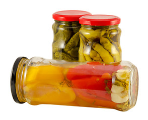 Image showing pickled jar pepper and cucumber isolated on white  