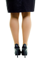 Image showing Female legs in skirt and high heels. isolated