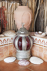 Image showing Clay pot and lantern