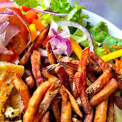 Image showing French fries and salad