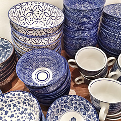 Image showing Blue ceramic plates and cups