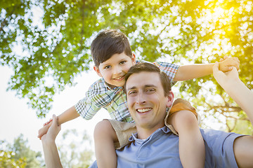 Image showing Father and Son Playing Piggyback in the Park