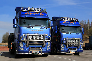 Image showing Two Customized Volvo FH13 Trucks