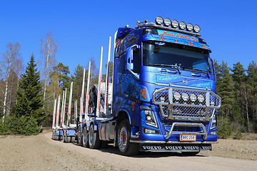 Image showing Blue Volvo FH16 750 Timber Truck on Rural Road