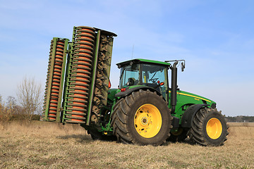 Image showing John Deere 8430 Agricultural Tractor with Ring Roller by Field