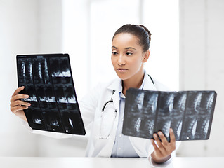 Image showing african doctor looking at x-rays