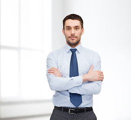 Image showing handsome businessman with crossed arms