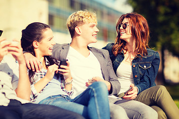 Image showing students looking at smartphones and tablet pc