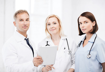 Image showing doctors looking at tablet pc