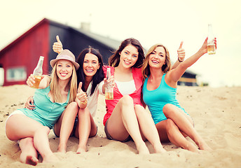 Image showing girls with drinks on the beach