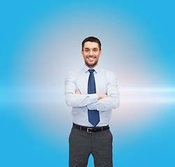 Image showing handsome businessman with crossed arms