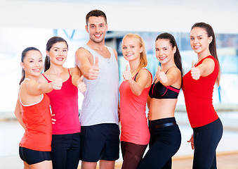 Image showing group of people in the gym showing thumbs up