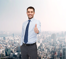 Image showing handsome businessman showing thumbs up