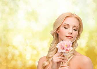 Image showing lovely woman with peony flower