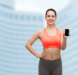 Image showing sporty woman with smartphone