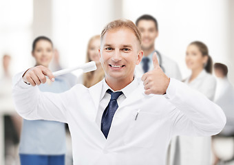 Image showing dentist with toothbrush in hospital