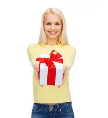 Image showing smiling girl with gift box