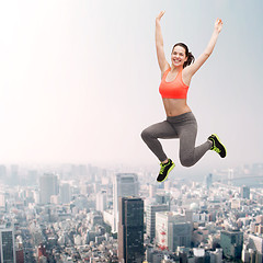 Image showing sporty teenage girl jumping in sportswear