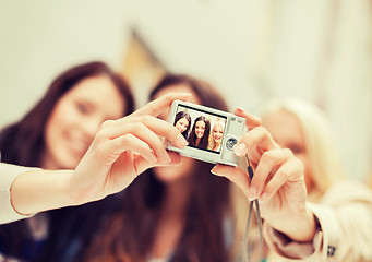 Image showing beautiful girls taking picture in the city