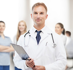 Image showing male doctor with stethoscope and clipboard