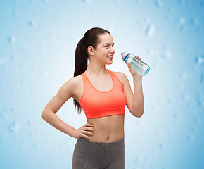 Image showing sporty woman with water bottle