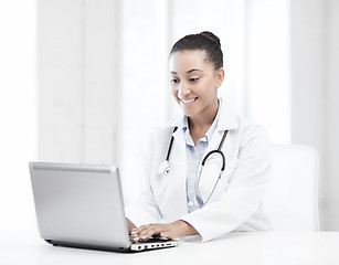 Image showing female doctor with laptop pc