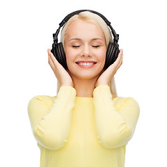 Image showing smiling young woman with headphones