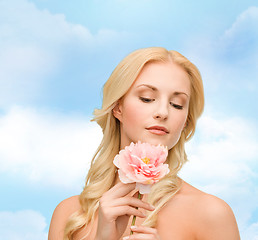 Image showing lovely woman with peony flower