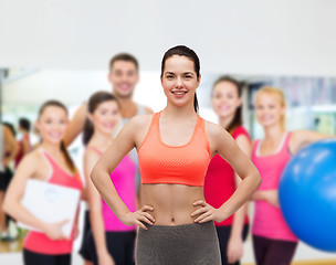 Image showing smiling teenage girl in sportswear