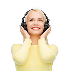 Image showing smiling young woman with headphones