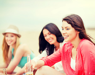 Image showing girls with drinks on the beach