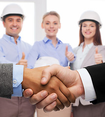 Image showing businessman and businesswoman shaking hands